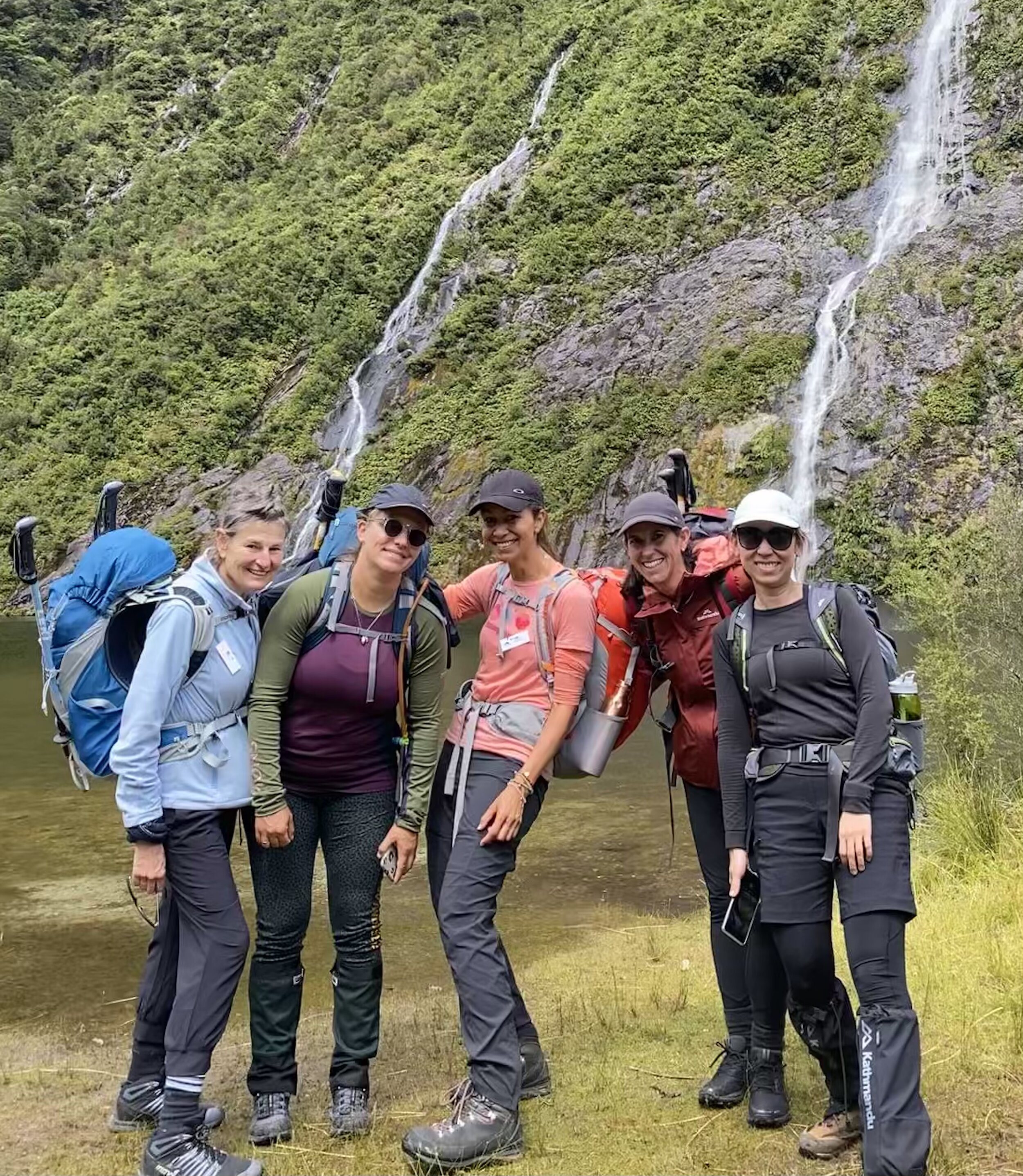 Lyzadie (in the center), with new friends she met on that adventure,  on a 4 day hike deep in Fjordland National Park.